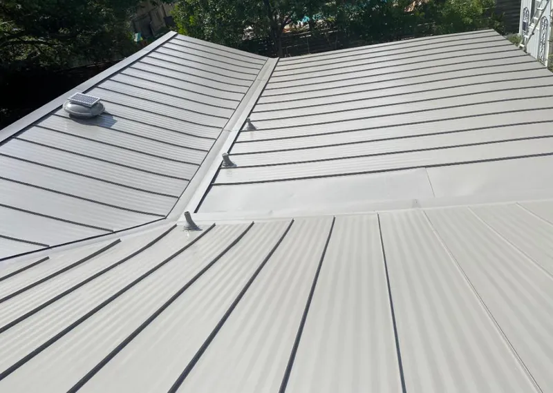 Solar attic fan installed on a metal roof for Roof Ventilation in Cotati